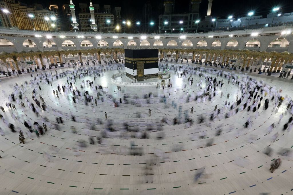A long exposure photograph shows Muslim pilgrims circumambulating around the Kaaba, Islam’s holiest shrine, at the Grand mosque in the holy Saudi city of Mecca during the annual hajj pilgrimage, on July 17, 2021. – The annual hajj pilgrimage, one of the five pillars of Islam, started with just 60,000 vaccinated Saudi residents allowed to take part this year because of the pandemic. For the second year in a row, Muslims from abroad have been excluded from the hajj, which drew 2.5 million pilgrims to Saudi Arabia in 2019 before the virus struck.