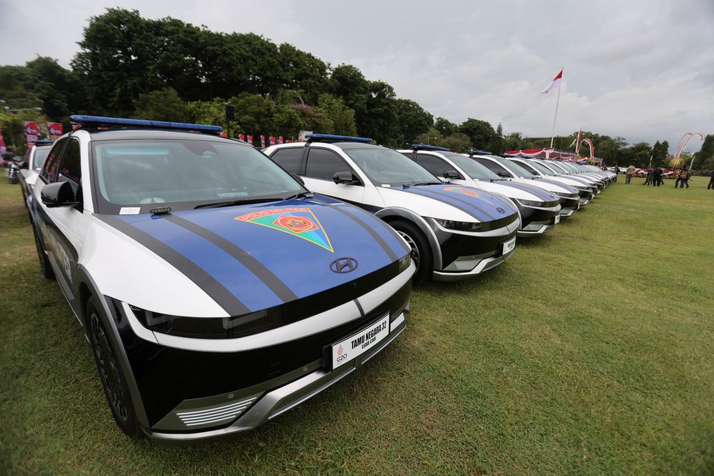 Electric cars are parked during a vigilance briefing for the G20 Presidency VVIP security measures at the Niti Mandala field, Renon, Denpasar. 
