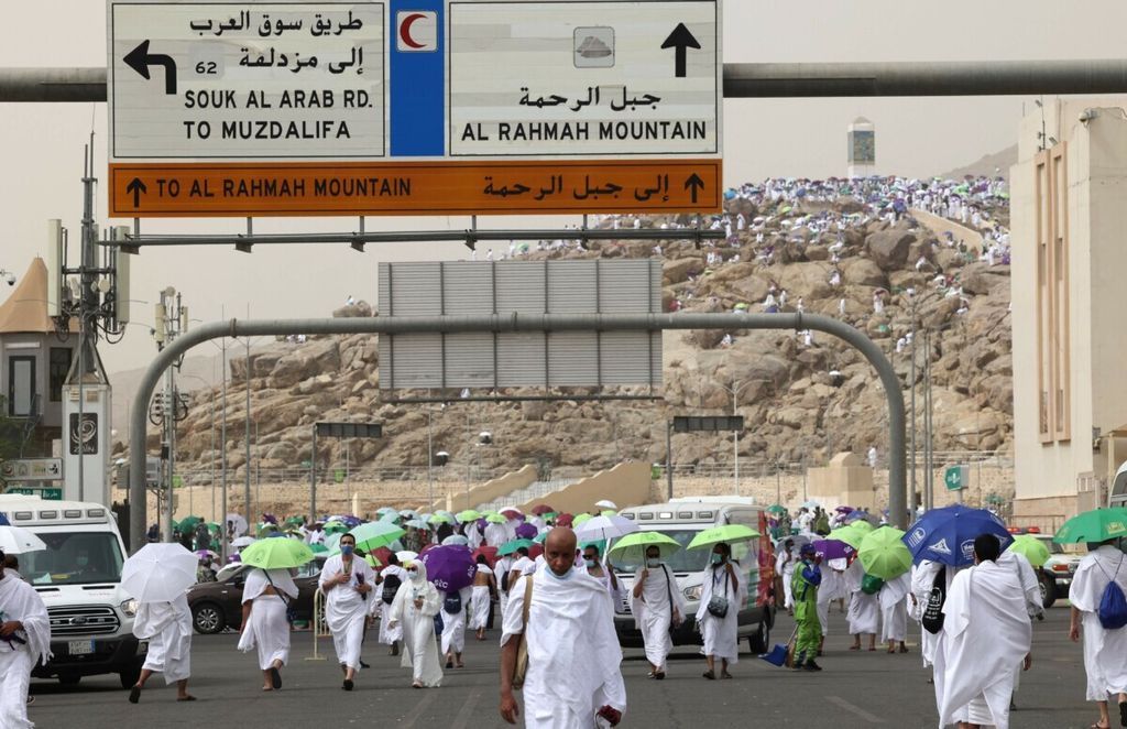 Muslim pilgrims gather around Mount Arafat, also known as Jabal al-Rahma (Mount of Mercy), southeast of the holy city of Mecca, during the climax of the Hajj pilgrimage amid the COVID-19 pandemic, on July 19, 2021. – Muslim pilgrims gathered at Mount Arafat today in the high point of this year’s hajj, being held in downsized form and under coronavirus restrictions for the second year running. Just 60,000 people, all citizens or residents of Saudi Arabia, have been selected to take part in this year’s hajj, with foreign pilgrims again barred. 