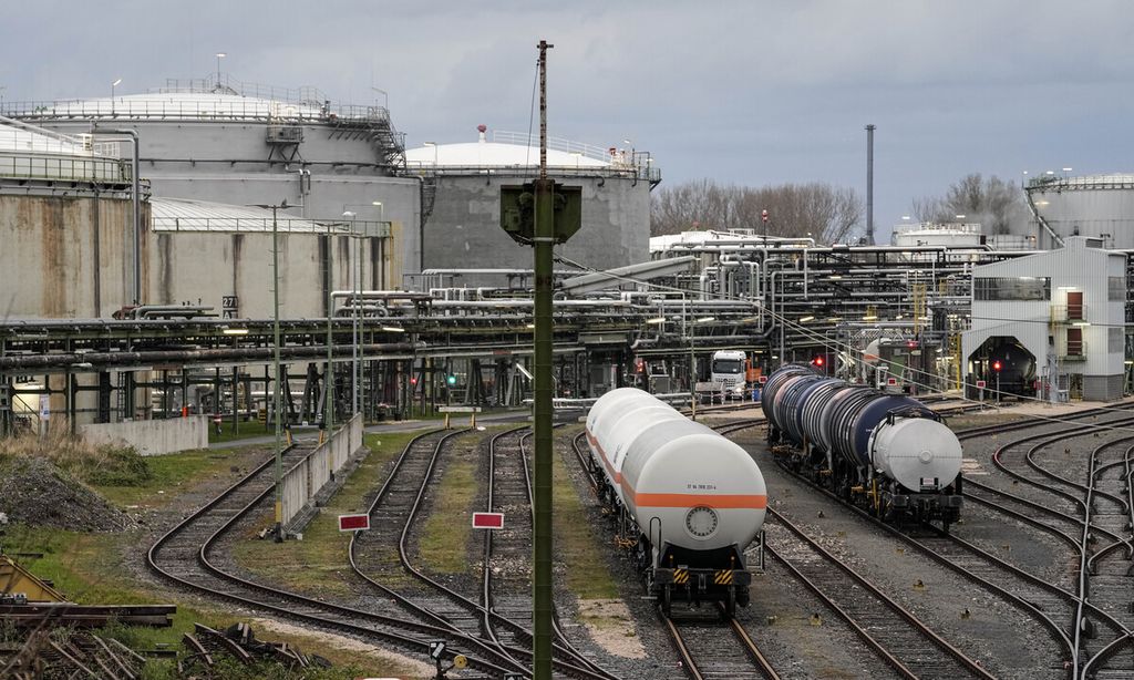 Wagons wait beside oil tanks in Wesseling, near Cologne, Germany, on April 6, 2022. Europe is staring an energy crisis in the face. The cause: Russia throttling back supplies of natural gas. European officials say it's a pressure game over their support for Ukraine after Russia's invasion. 
