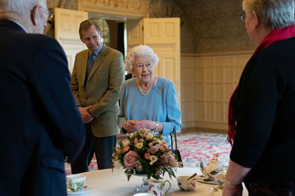 Britain's Queen Elizabeth II (C) talks to pensioners from the Sandringham Estate during a reception in the Ballroom of Sandringham House, the Queen's Norfolk residence on February 5, 2022, as she celebrates the start of the Platinum Jubilee. - Queen Elizabeth II on Sunday will became the first British monarch to reign for seven decades, in a bittersweet landmark as she also marked the 70th anniversary of her father's death. 