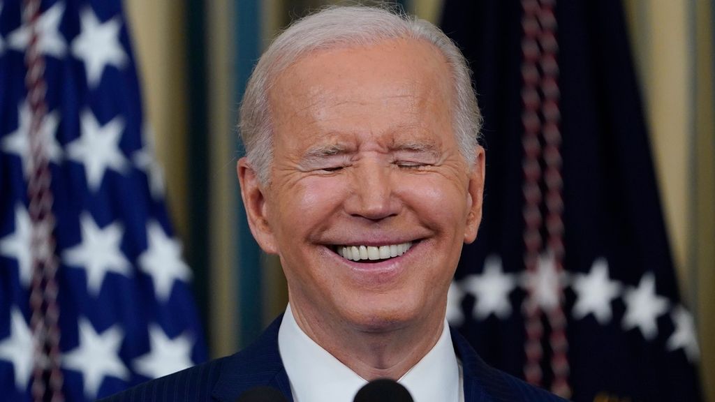 President Joe Biden smiles as he speaks in the State Dining Room of the White House in Washington, Wednesday, Nov. 9, 2022. 