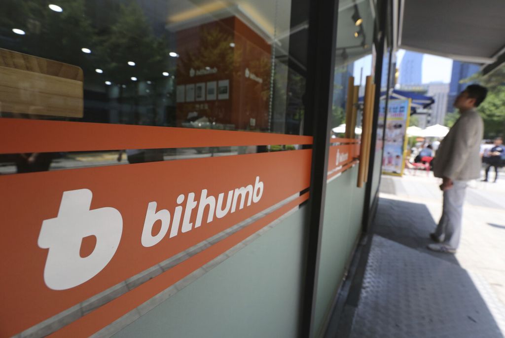 A man watches the prices of bitcoin at Bithumb cryptocurrency exchange in Seoul, South Korea, Wednesday, June 20, 2018. Bithumb, South Korea's second-largest exchange, said Wednesday that $31 million worth of virtual currencies have been stolen by hackers, a latest in the series of recent hacks that raised security concerns.