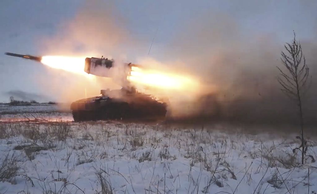 In this image taken from video and released by Russian Defense Ministry Press Service, A Russian rocket launcher fires during military drills near Orenburg in the Urals, Russia, Thursday, Dec. 16, 2021. Amid a buildup of Russian troops near Ukraine, Moscow has denied planning an attack on Ukraine but urged the U.S. and its allies to provide a binding pledge that NATO won't expand to Ukraine and won't deploy military assets there _ a demand rejected by the West. 