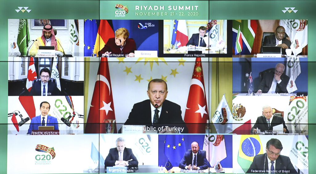 Turkey’s President Recep Tayyip Erdogan addresses the virtual G20 Leaders’ Summit in Riyadh, Saudi Arabiain, in a video conference from his Vahdettin Pavilion, in Istanbul, Sunday, Nov. 22, 2020. Erdogan said Sunday that Turkey sees itself as a part of Europe, but he called on the European Union to “keep your promises” on issues such as the country’s membership bid and refugees.